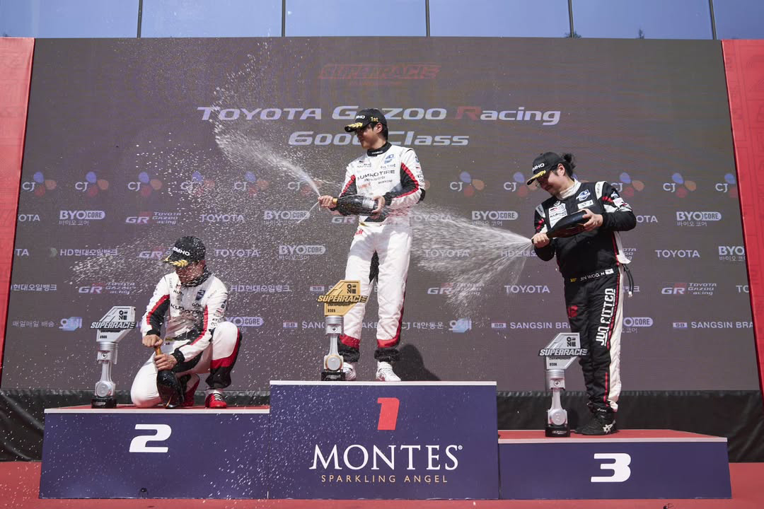 superrace-podium-champagne-shower.jpg